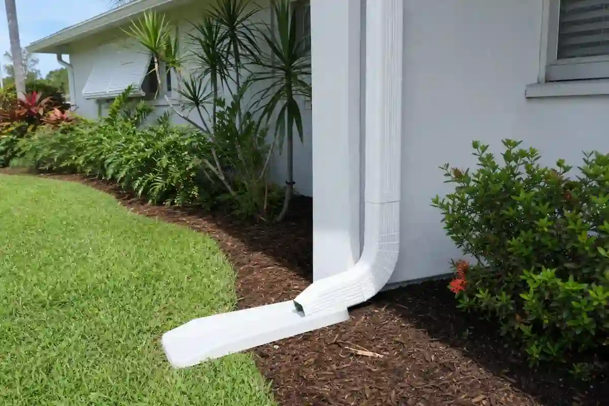 New downspout directing roof runoff away from a Florida home